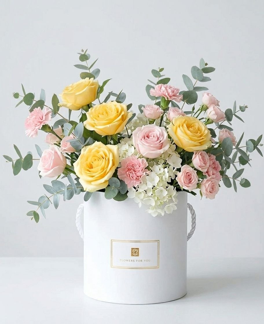 A magnificent combination of airy white hydrangeas, single-stem roses, spray roses, carnations, and fragrant eucalyptus.